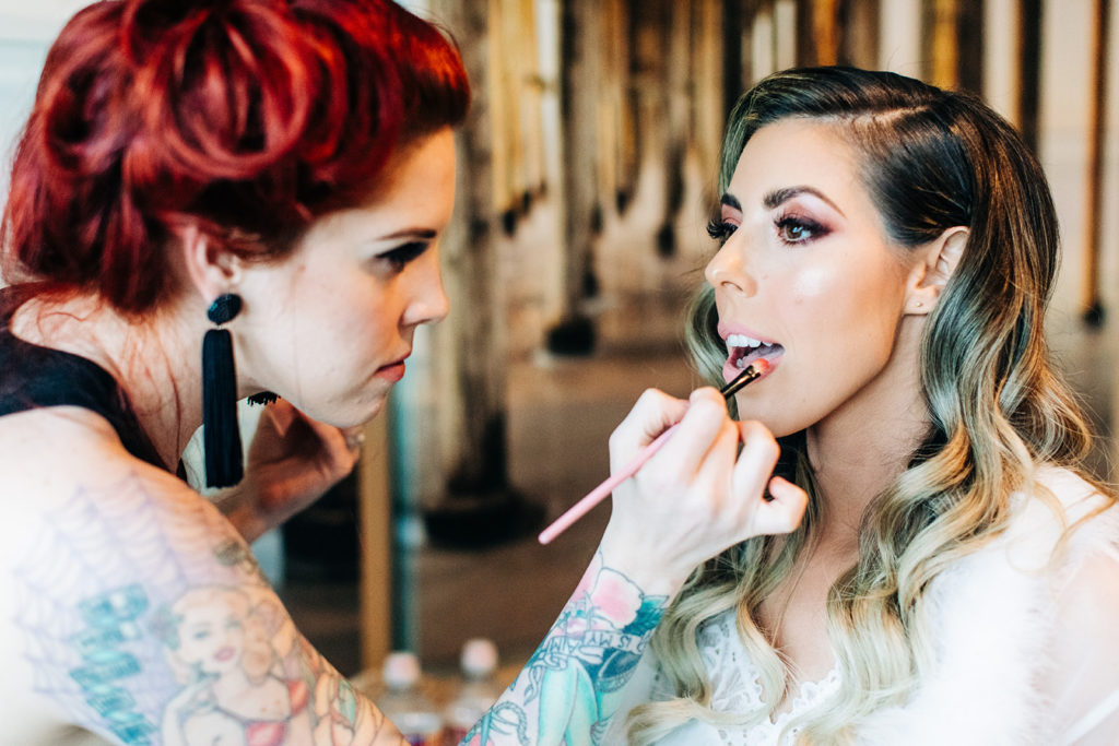 Hartley Botanica wedding photography; bride getting her lipstick done