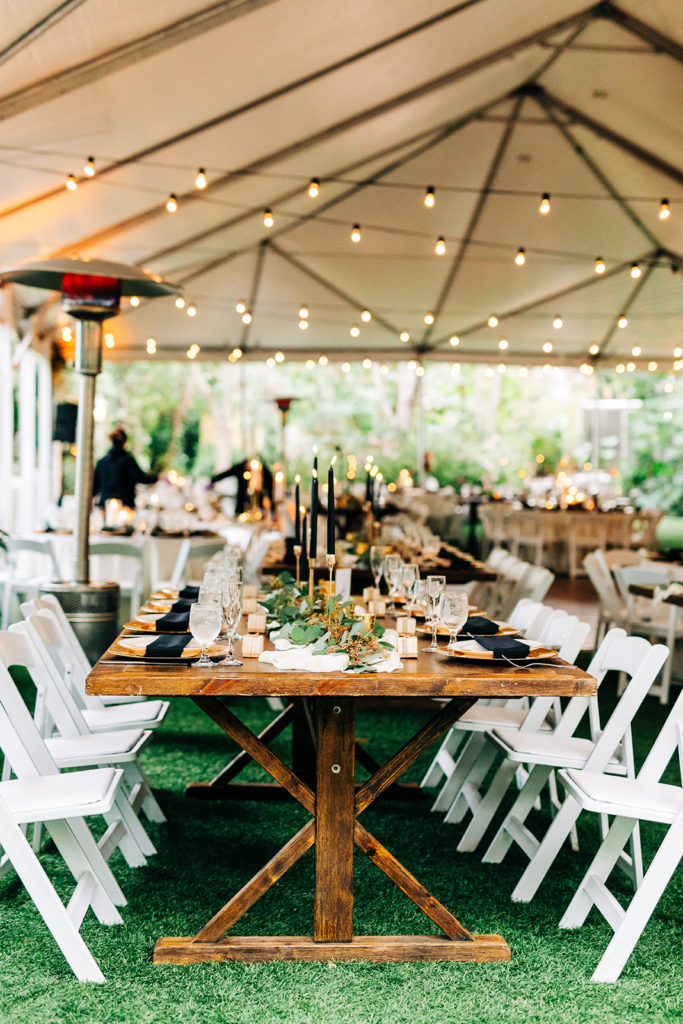 Hartley Botanica wedding photography; covered seating with string lights and wooden tables