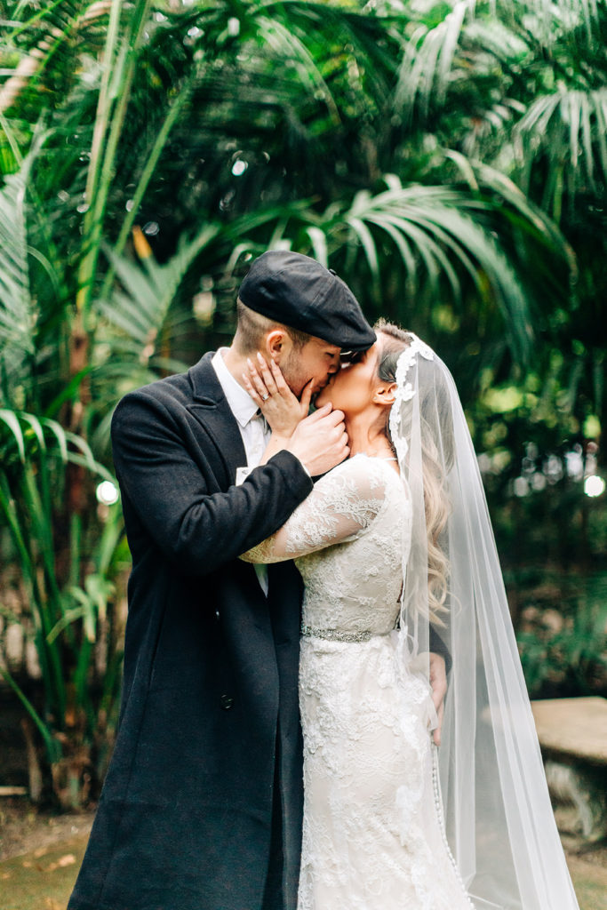 Hartley Botanica wedding photography; bride and groom kissing after wedding ceremony outdoors
