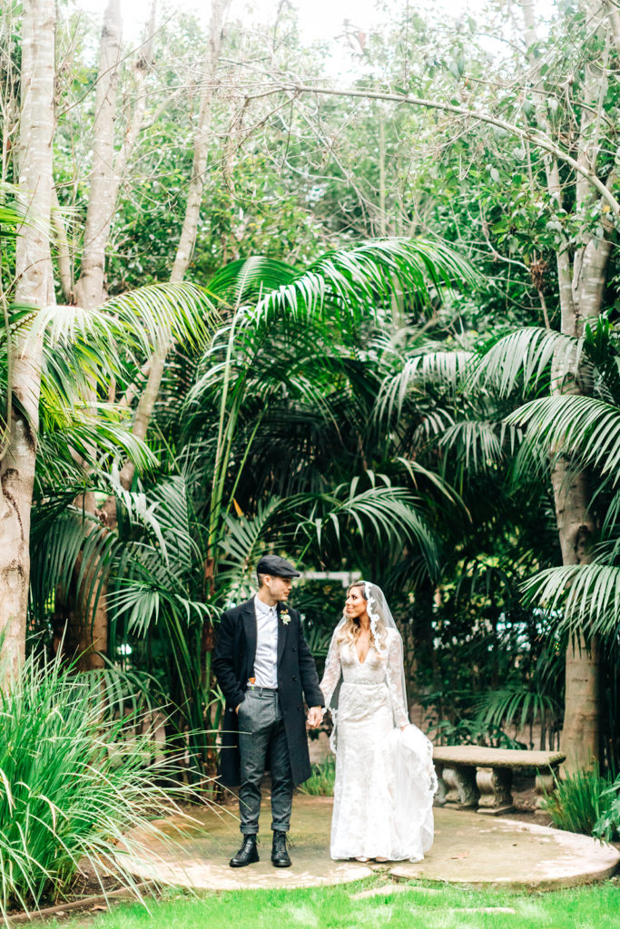 Hartley Botanica wedding photography; bride and groom walking together after Peaky Blinders inspired wedding