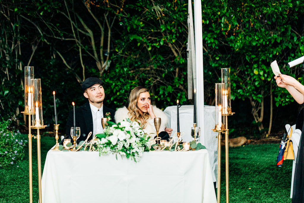 Hartley Botanica wedding photography; bride and groom watch bridesmaid give speech at wedding reception