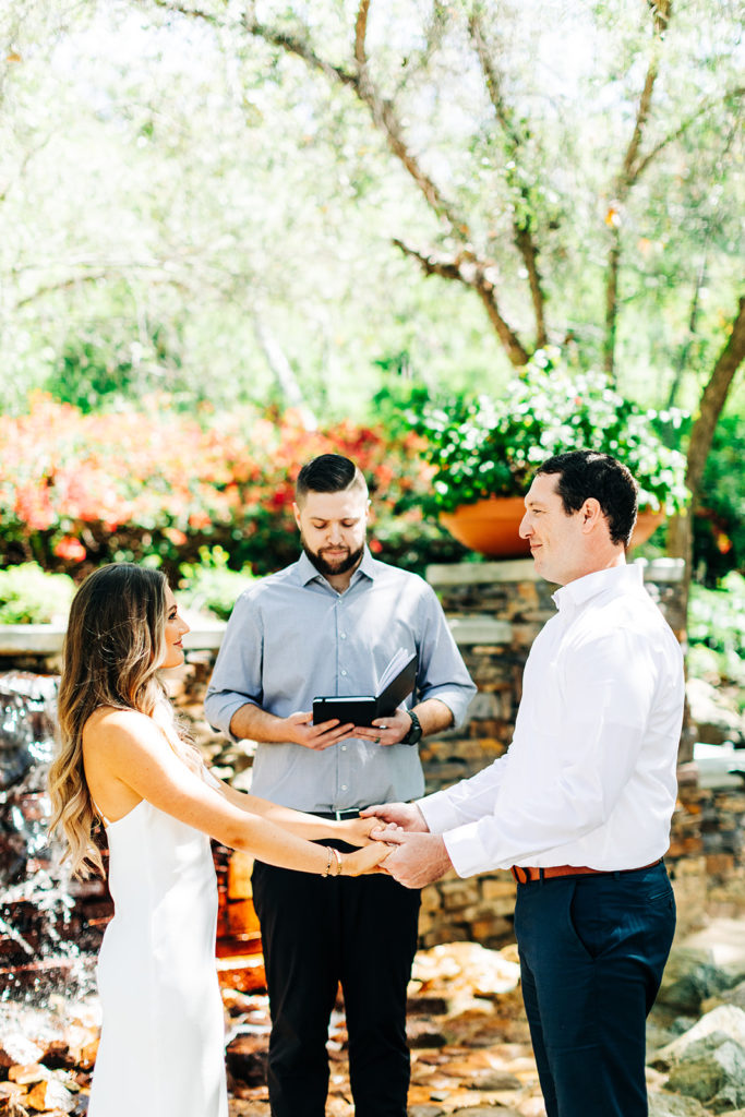 bride and groom sharing vows on their wedding day; orange county elopement photographer