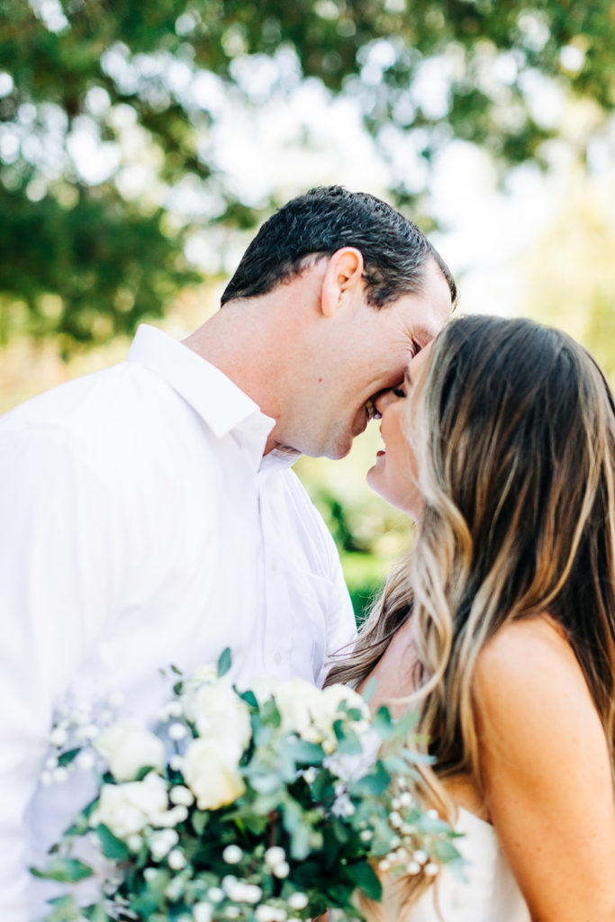 bride and groom kissing on their wedding day; orange county elopement photographer