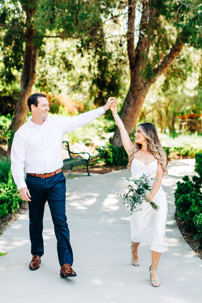 bride and groom walking and celebrating at an outdoor wedding; orange county elopement photographer