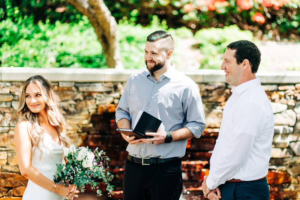 bride and groom and officiant at an outdoor wedding; orange county elopement photographer