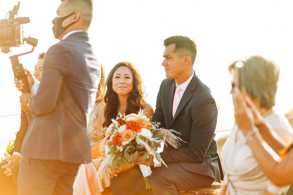 Crystal Cove Micro Wedding in Orange County; bridesmaid smiling during the wedding