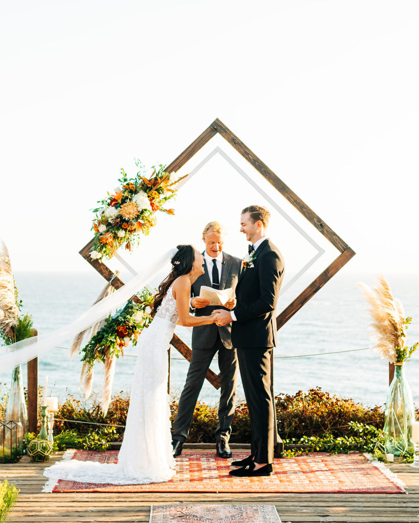 Crystal Cove Micro Wedding in Orange County; bride and groom laughing at their micro wedding in orange county, california