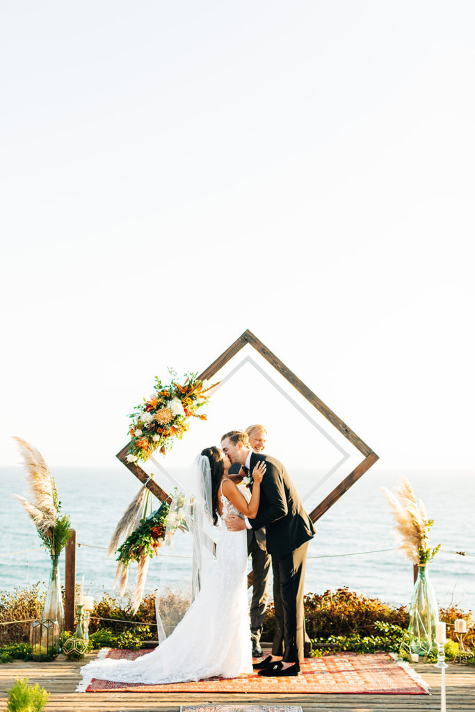 Crystal Cove Micro Wedding in Orange County; first kiss as husband and wife at a micro wedding at crystal cove state beach in orange county, california
