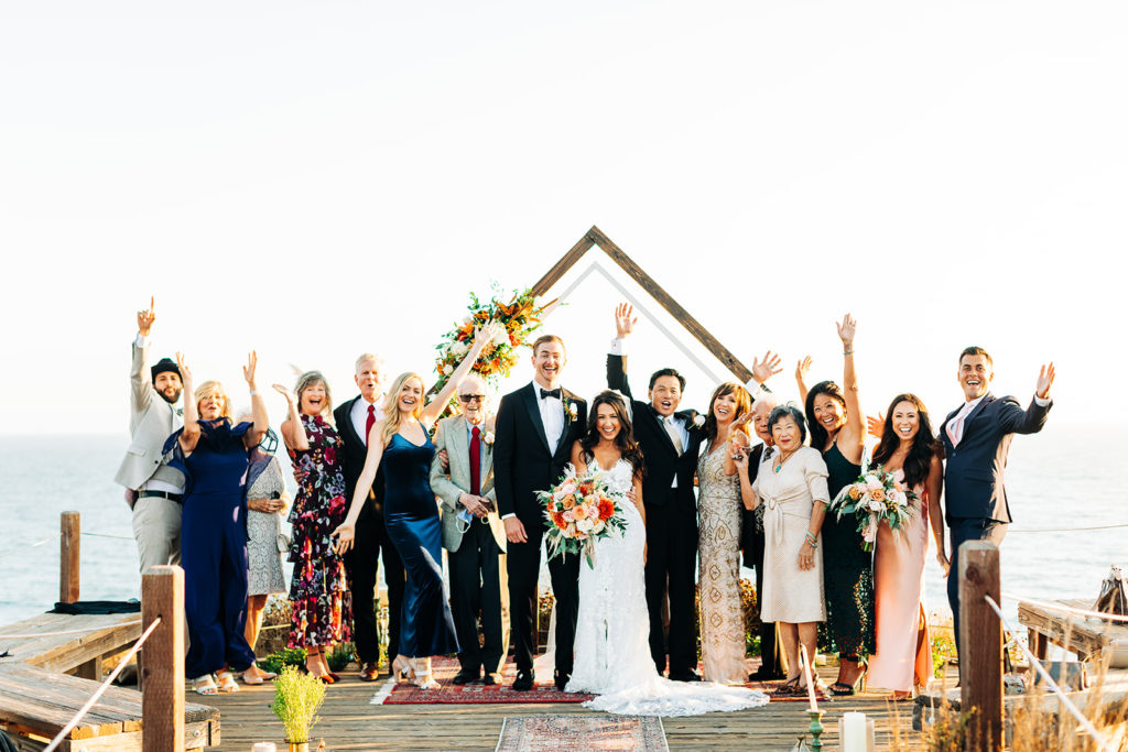 Crystal Cove Micro Wedding in Orange County; group photo of family and bride and groom at their wedding