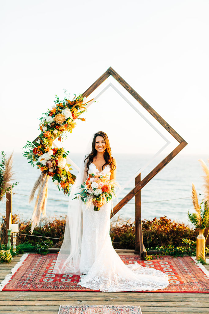 Crystal Cove Micro Wedding in Orange County; portrait of a bride on her wedding day during golden hour at the beach