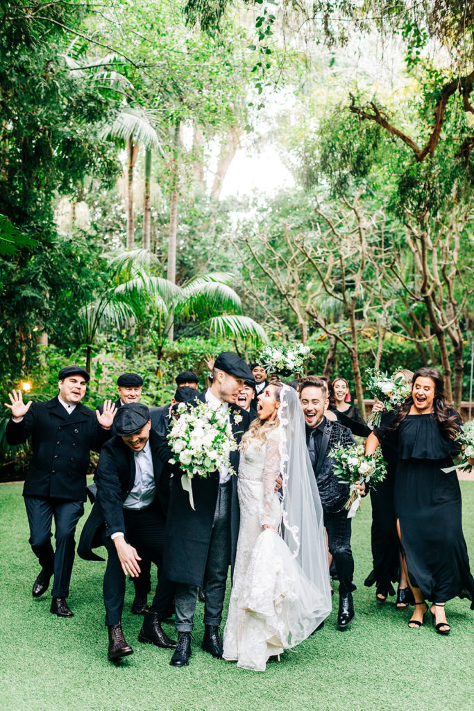 Hartley Botanica wedding photography; bride and groom smiling with wedding party