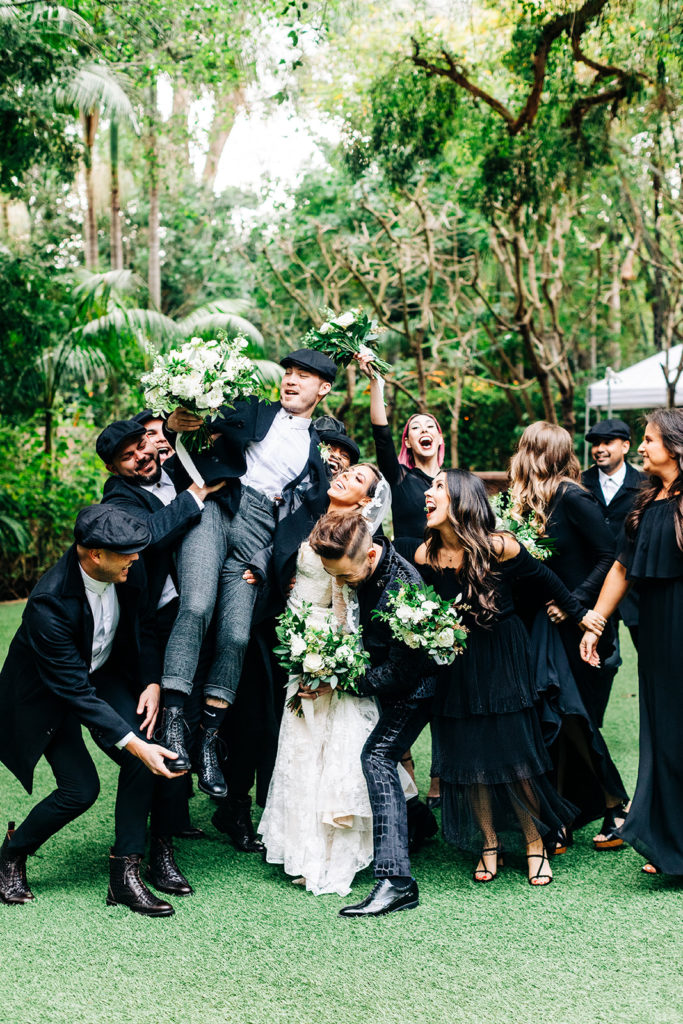 Hartley Botanica wedding photography; wedding party lifts groom up