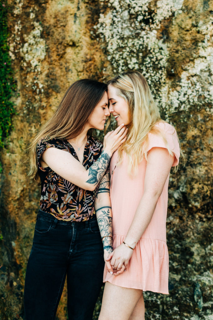 LGBTQ+ wedding photographer in san diego; a lesbian couple holding hands and touching foreheads together