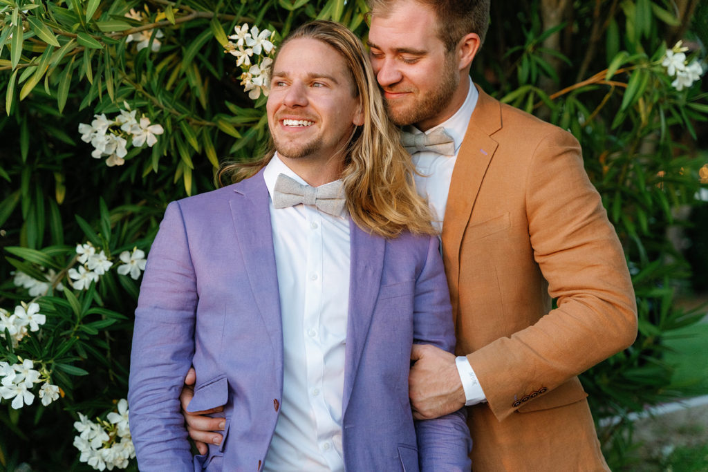 queer wedding photographer in san diego; pk & mike, gay bloggers, hold each other on their wedding day