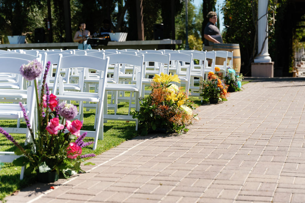 colorful aisle floral arrangement for a gay wedding; gay wedding in temecula at mount palomar winery