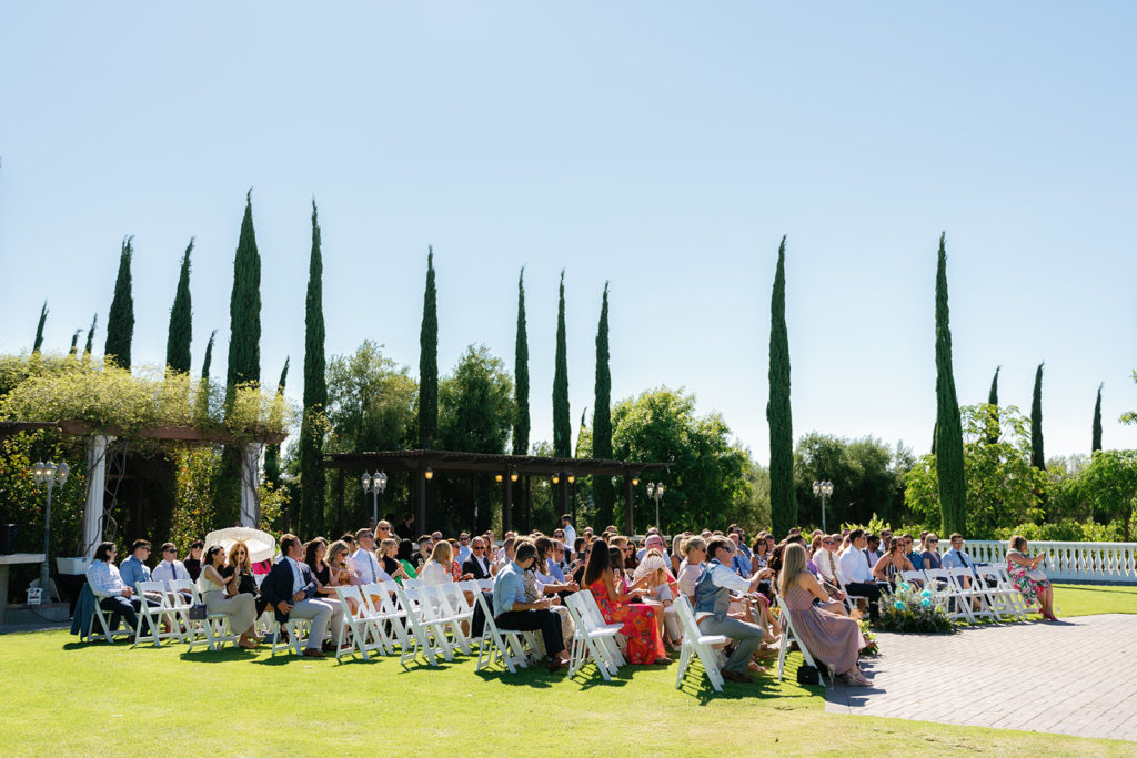 wedding guests wait for the wedding to start; gay wedding in temecula at mount palomar winery
