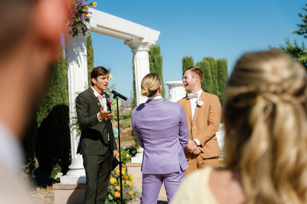 Ashton Kutcher makes grooms PK & Mike laugh during their wedding ceremony; gay wedding in temecula at mount palomar winery