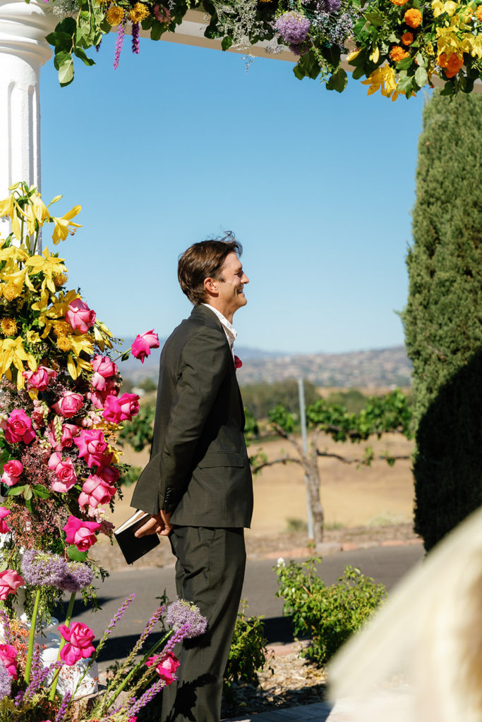 Ashton Kutcher stands off to the side as PK & Mike read their wedding vows; gay wedding in temecula at mount palomar winery