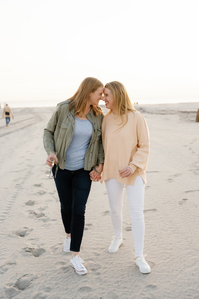 queer wedding photographer in San Diego; two women walking hand in hand during their engagement session