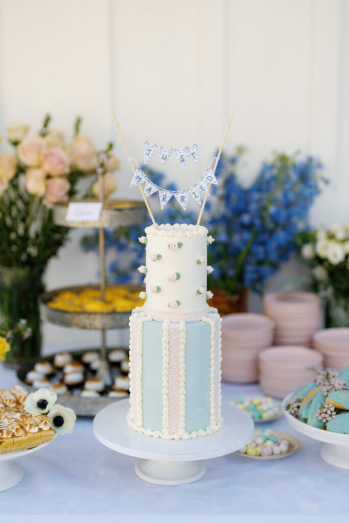 san diego micro wedding in solana beach; wedding cake and desserts on display at a wedding