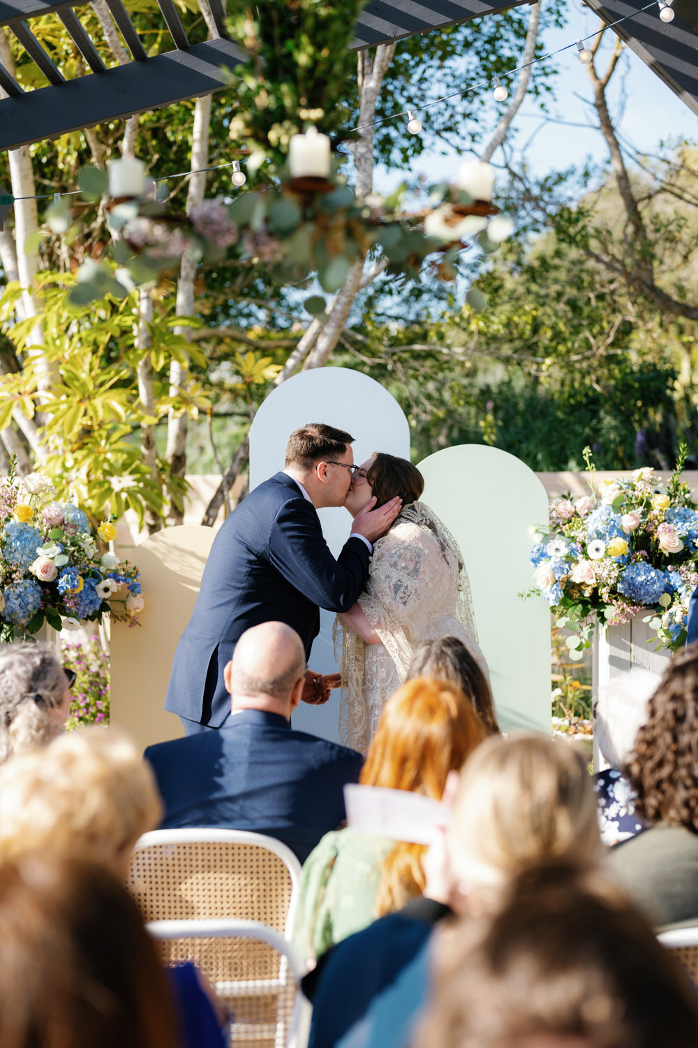 san diego micro wedding in solana beach; the couple's first kiss during the ceremony at their wedding